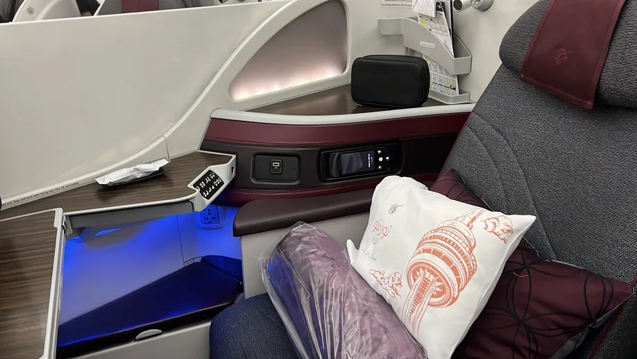 Voando de Executiva Qatar poltrona